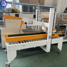 máy dán băng dính thùng carton tự động gấp mép